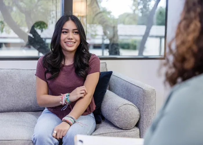 young woman talking to a therapist.